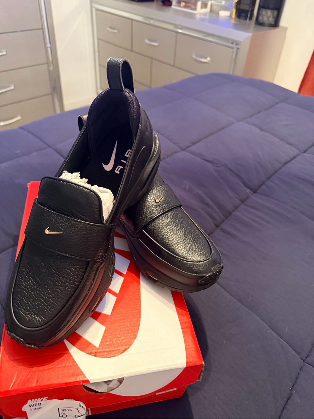 Nike Black Leather Slip-On Loafers with Small Gold Swoosh